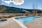 Heated outdoor pool with fantastic mountain and slope views at Red Hawk Lodge